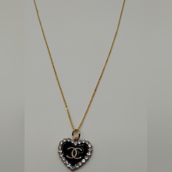 CHANEL Jewelry - Chanel Black and Gold Heart Authentic Charm On A Stainless Steel Necklace